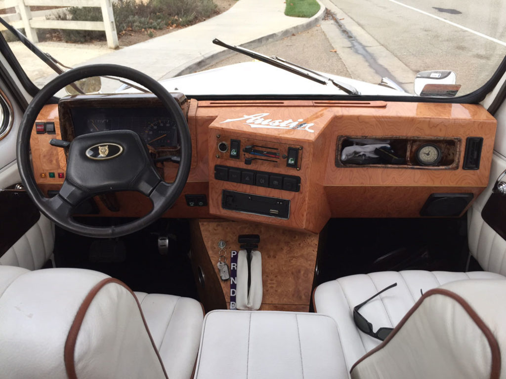 Wooden dashboard of white London Taxi